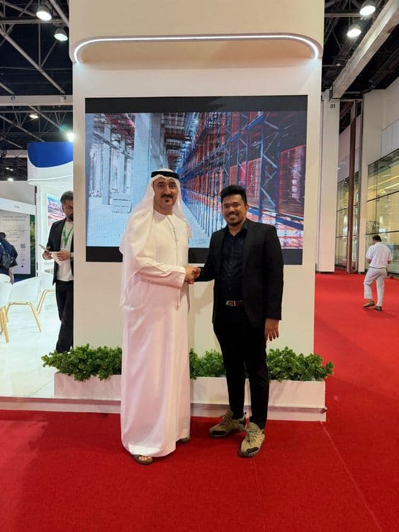 ABWAB Holdings and Storygame leadership shaking hands at a Dubai exhibition